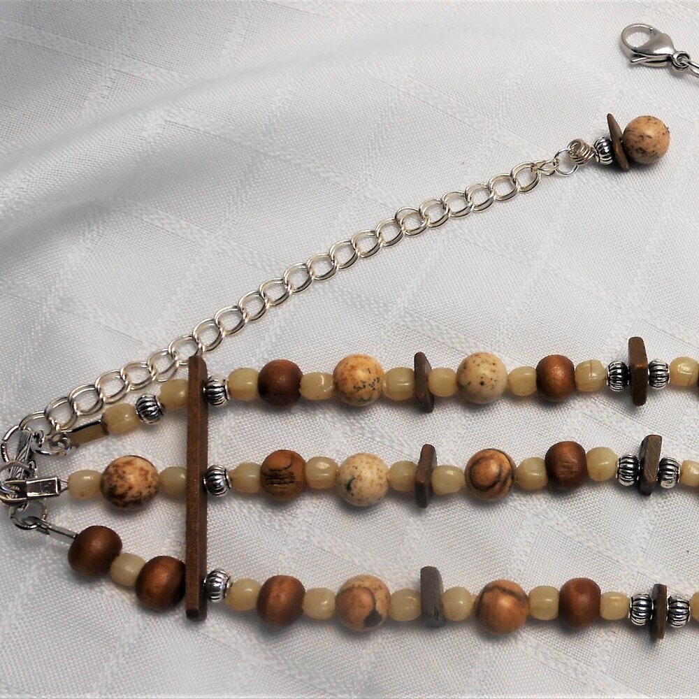 No 536 Handmade choker necklace with several rows of polished stones & earrings